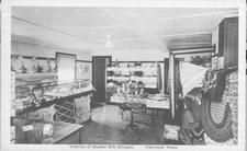 SA1324.5 - Shows many kinds of goods, including braided rugs, baskets, and stuffed dolls., Winterthur Shaker Photograph and Post Card Collection 1851 to 1921c